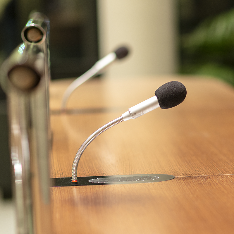 Microphones on desk for audience meembers