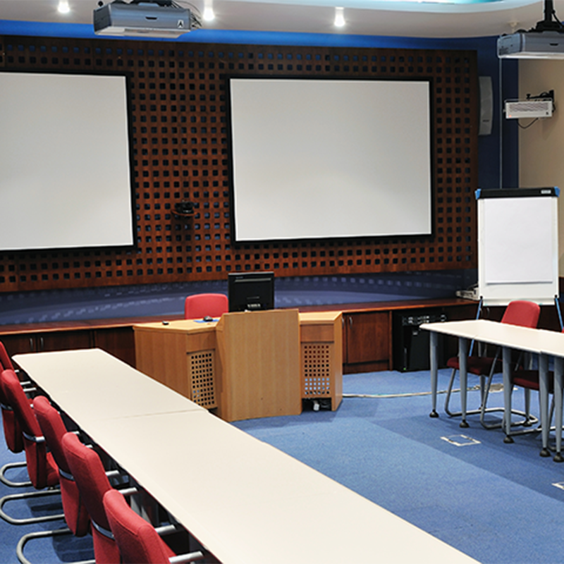 Large boardroom with projector screens